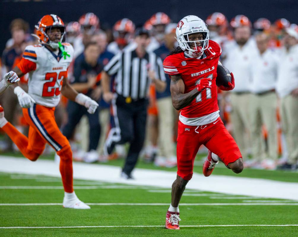 UNLV wide receiver Ricky White III (11) sprints down the field as Syracuse Orange defensive bac ...