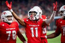 UNLV wide receiver Ricky White III (11) celebrates after scoring a touchdown during the college ...