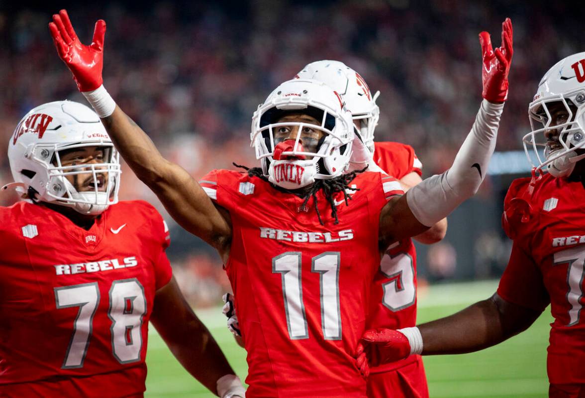 UNLV wide receiver Ricky White III (11) celebrates after scoring a touchdown during the college ...