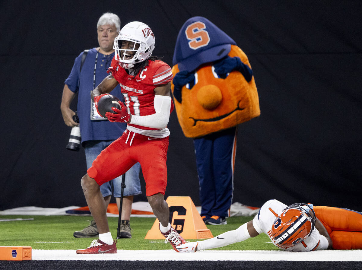 UNLV wide receiver Ricky White III (11) celebrates a big run during the college football game a ...