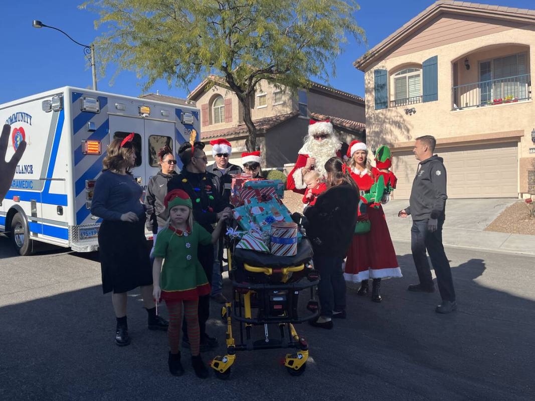 Community Ambulance delivers Christmas gifts to the Hansen Family, including Sarah Hansen and h ...