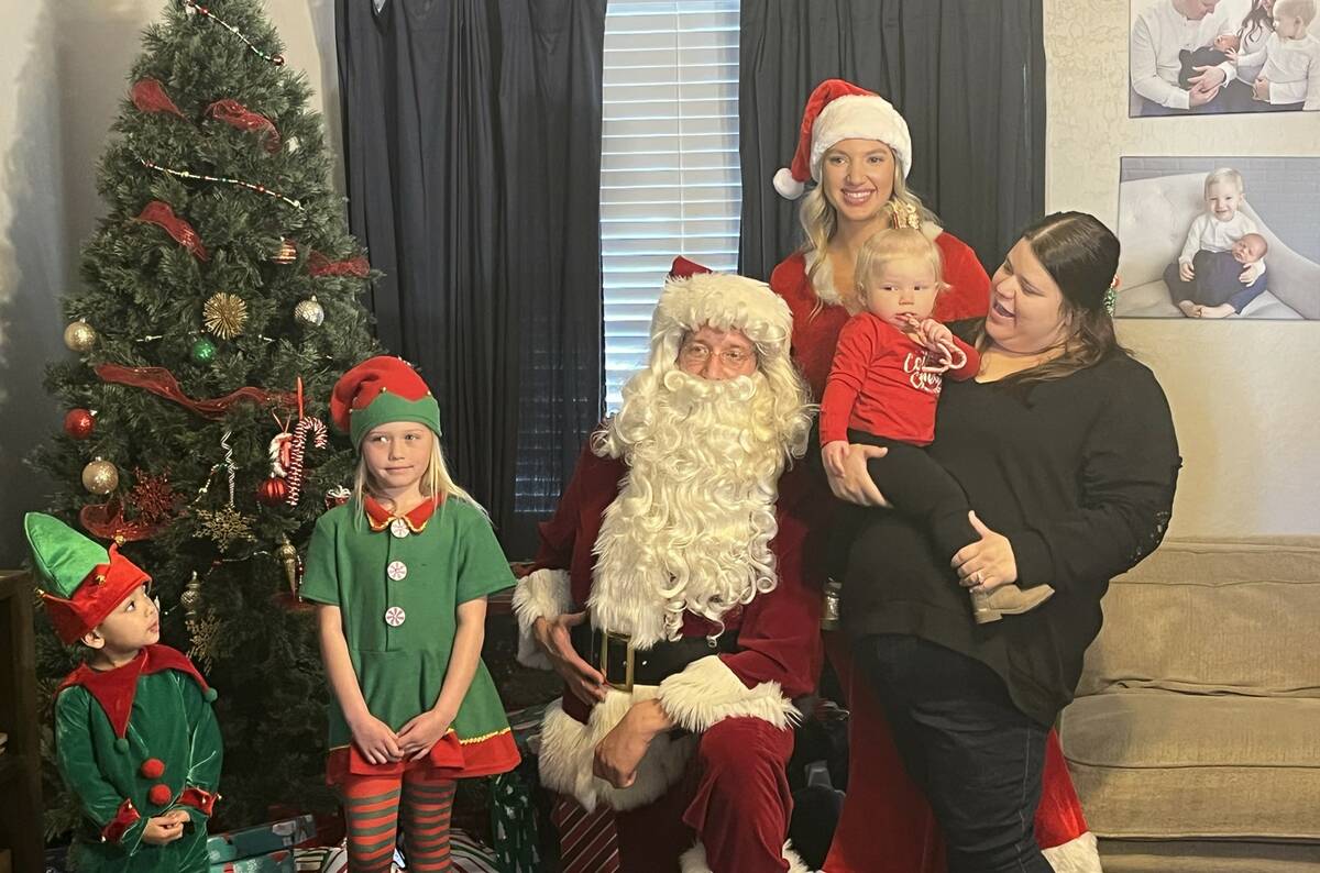 Community Ambulance delivers Christmas gifts to the Hansen Family, including Sarah Hansen and h ...