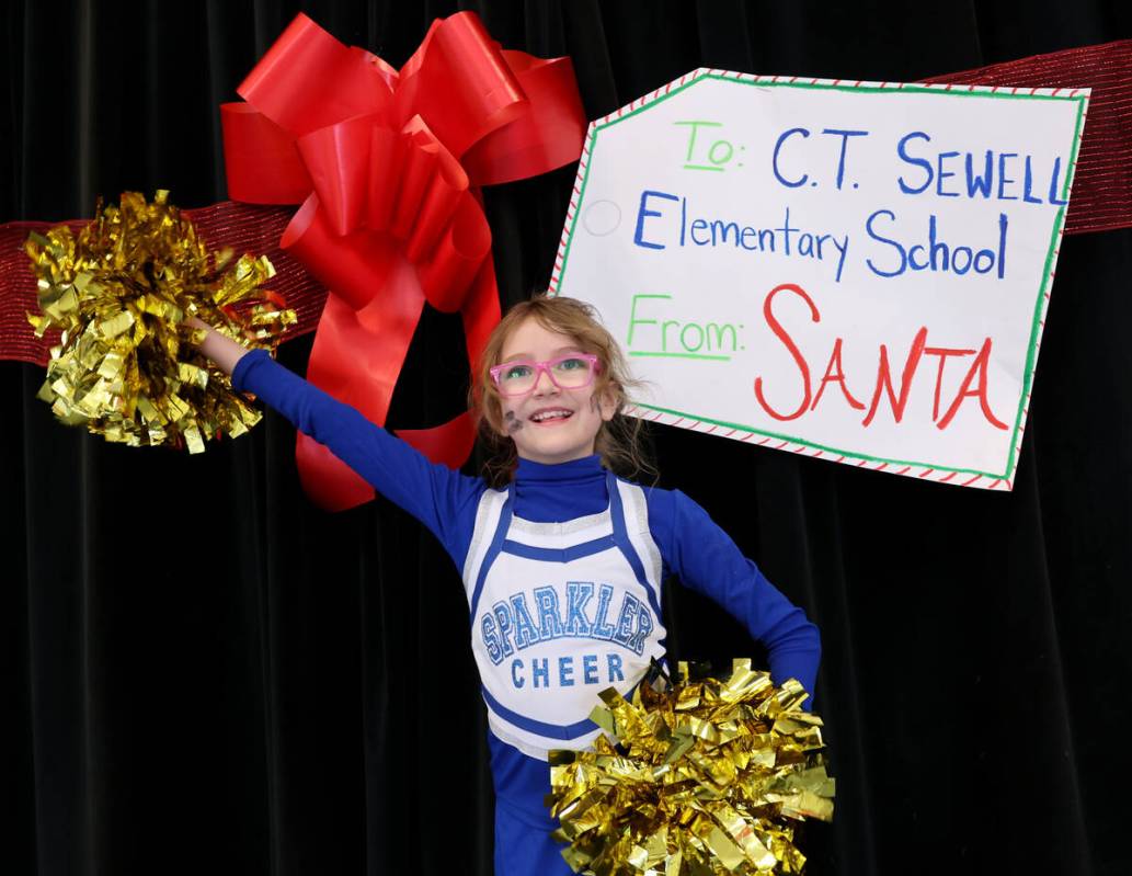 Sierra Despain gets her fellow students fired up for a holiday party at Sewell Elementary Schoo ...