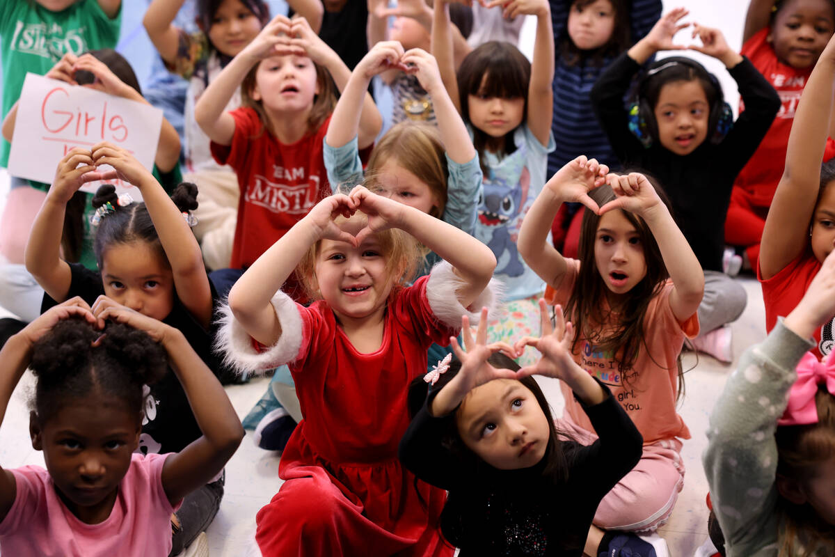 Kindergartners, including Melialani Ramos, center, thank donors during a holiday party at Sewel ...