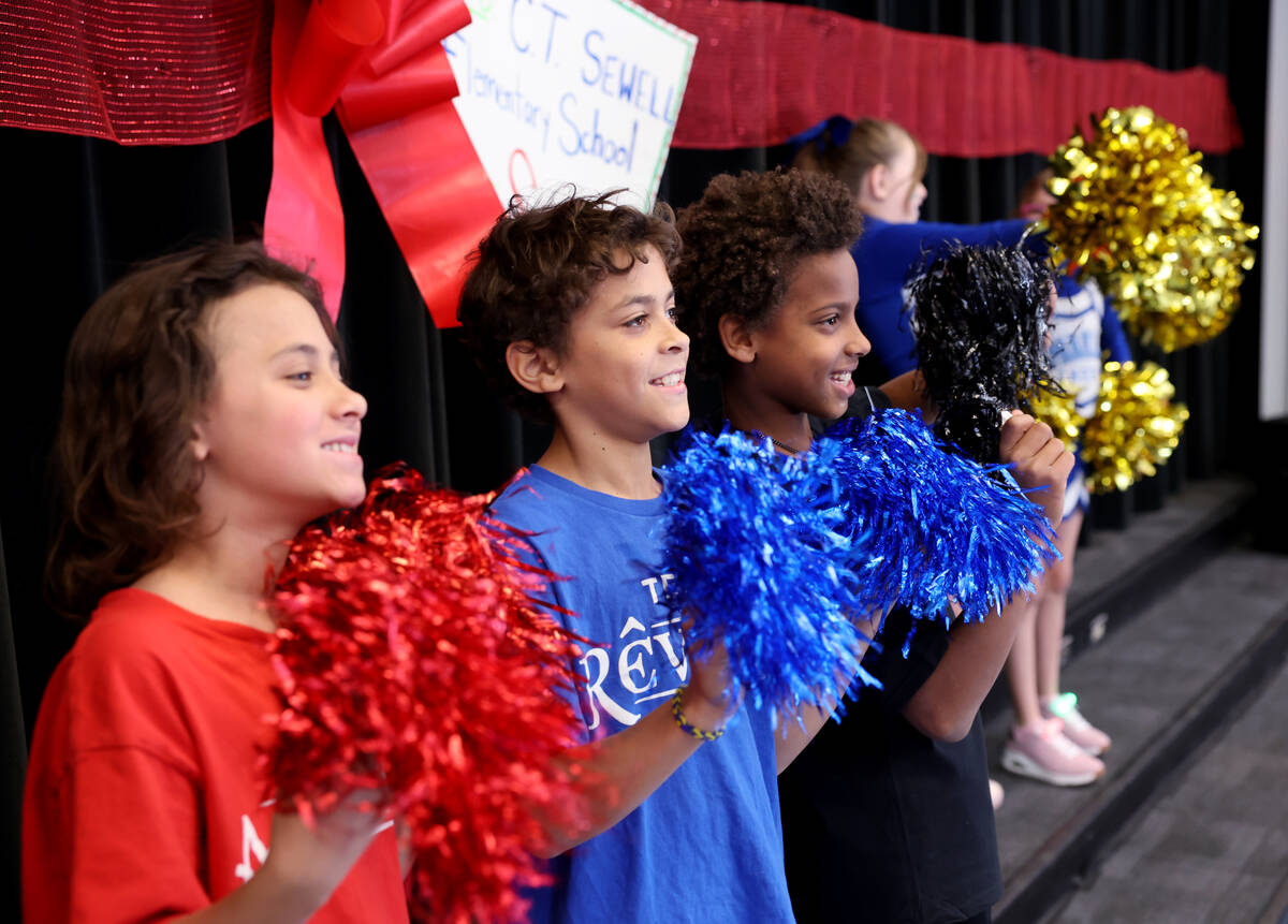 Rebel Mawson, from left, K’Leeyan Stevens and Jace Bales get fellow students fired up fo ...