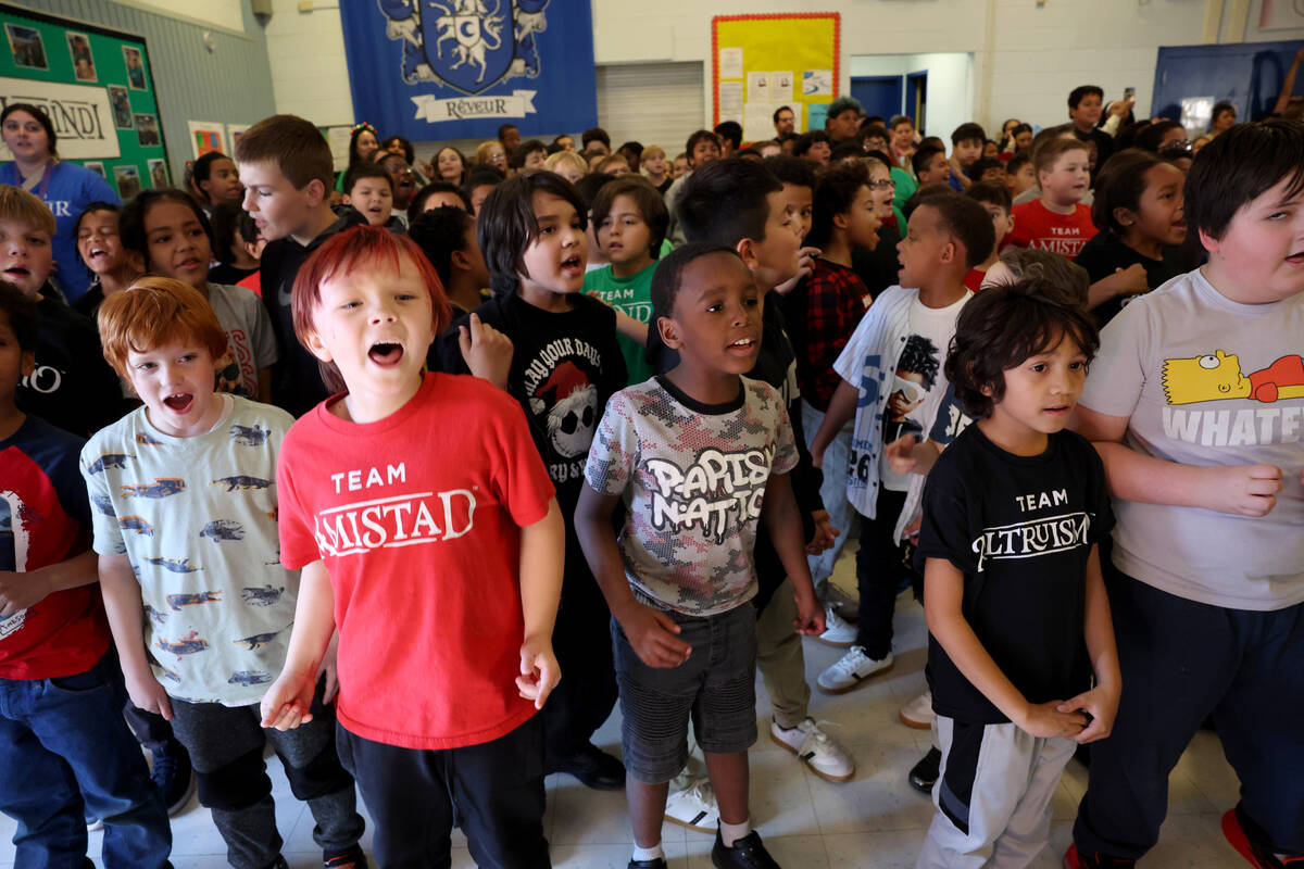 Students get fired up during a holiday party at Sewell Elementary School in Henderson Friday De ...