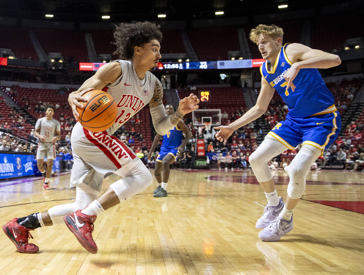 UNLV guard Brooklyn Hicks (13) attempts to pass UC Riverside Highlanders guard Parker Strauss ( ...