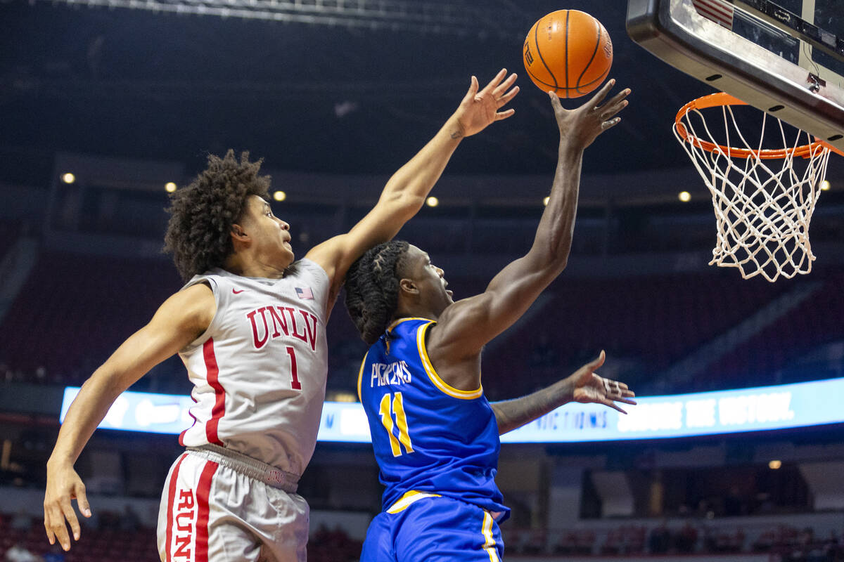 UNLV forward Jalen Hill (1) attempts to swat away a layup by UC Riverside Highlanders guard Nat ...