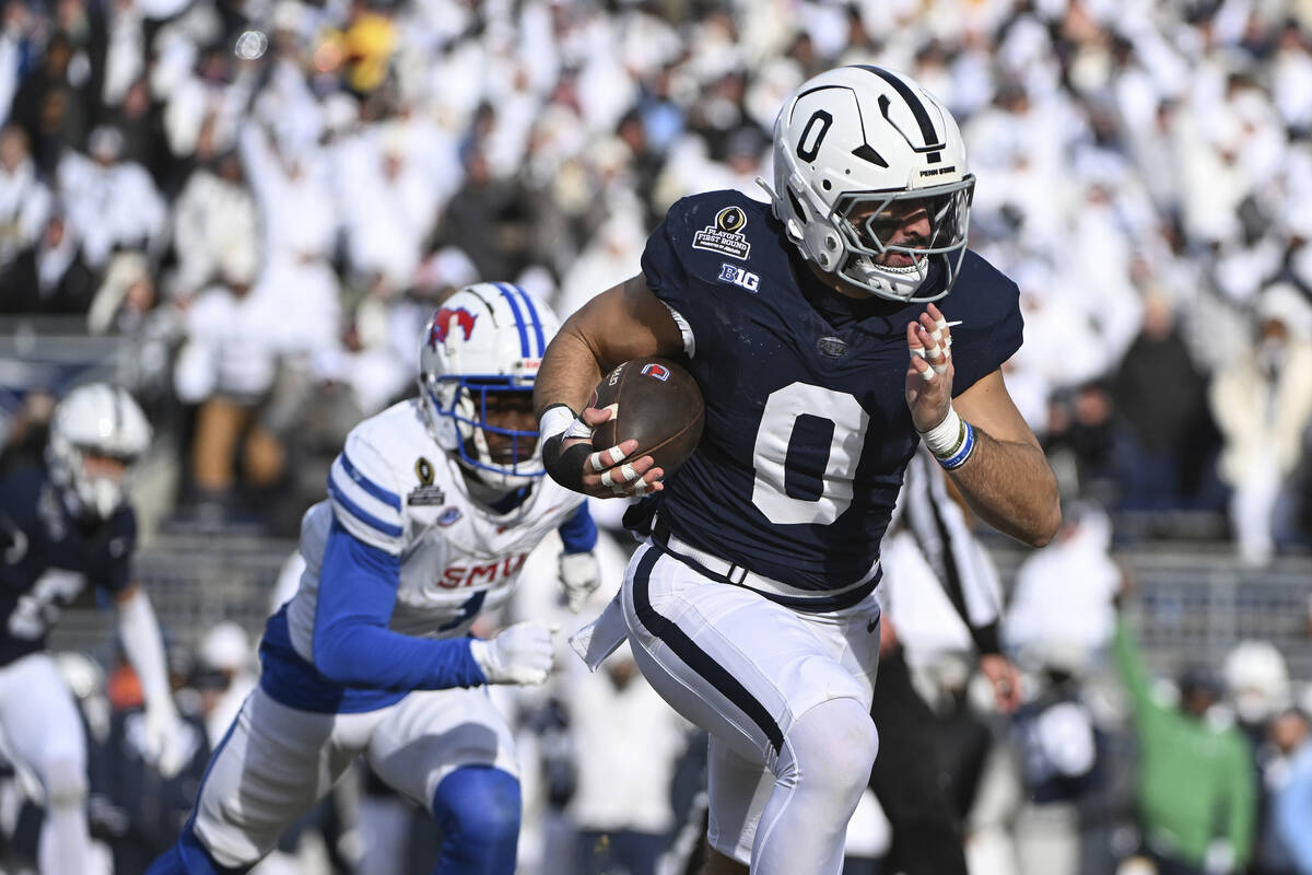 Penn State linebacker Dominic DeLuca returns an interception for a touchdown while being chased ...