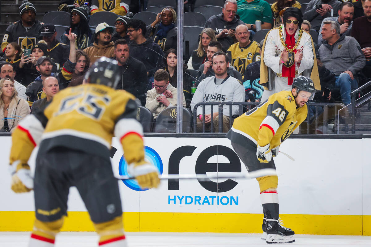 A Golden Knights fan dressed as Elvis cheers for Golden Knights center Tomas Hertl (48) before ...