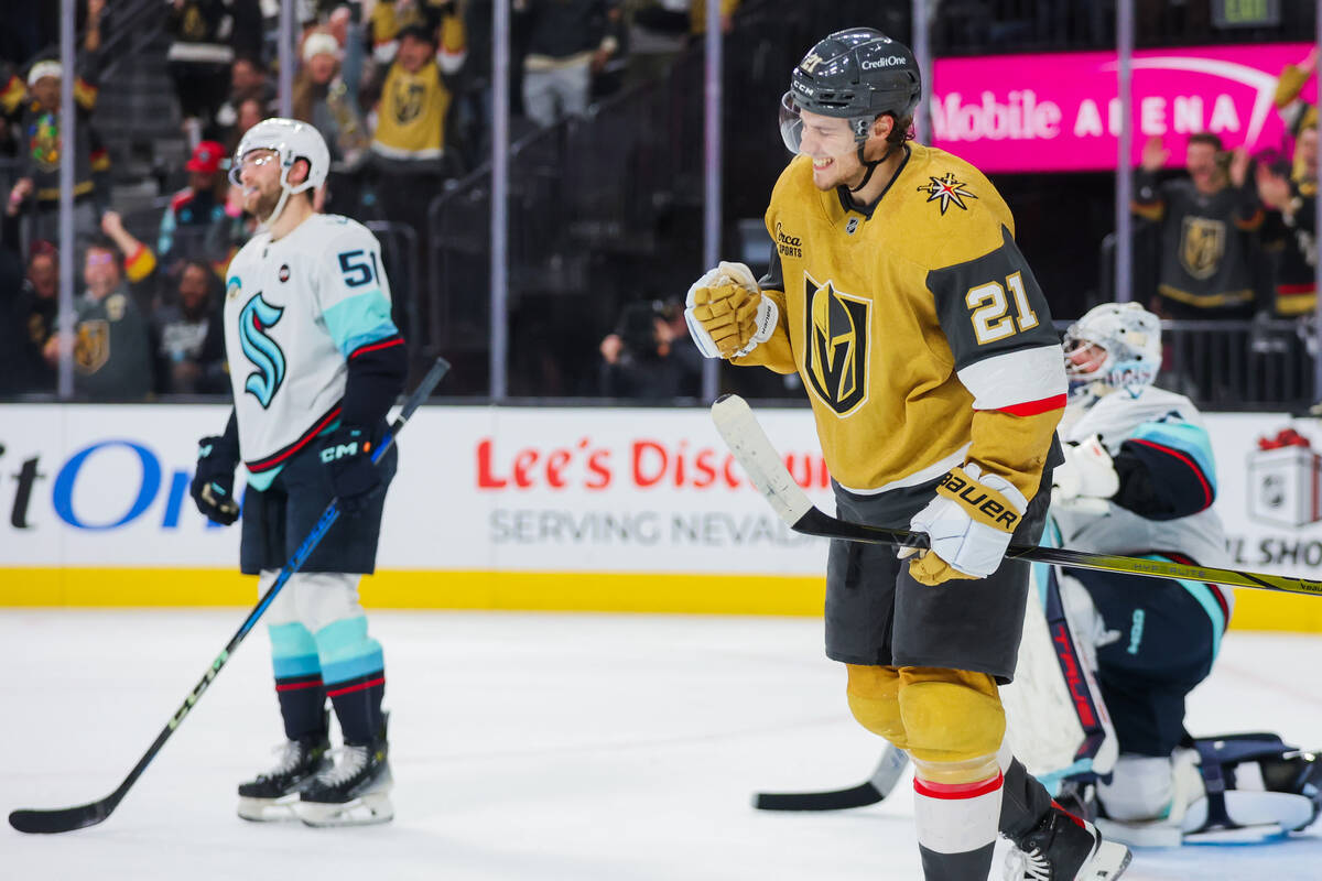 Golden Knights center Brett Howden (21) celebrates a goal by a teammate during an NHL hockey ga ...