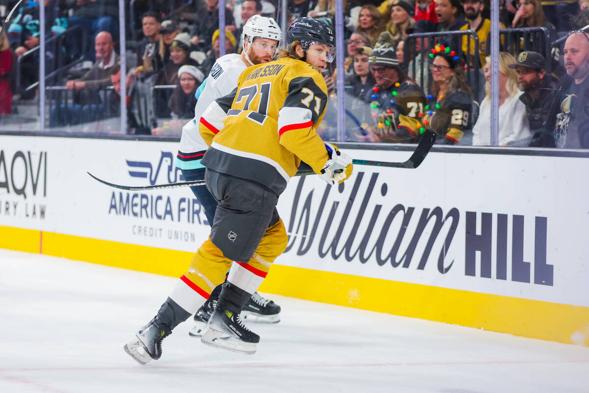 Golden Knights center William Karlsson (71) and Seattle Kraken defenseman Adam Larsson (6) redi ...