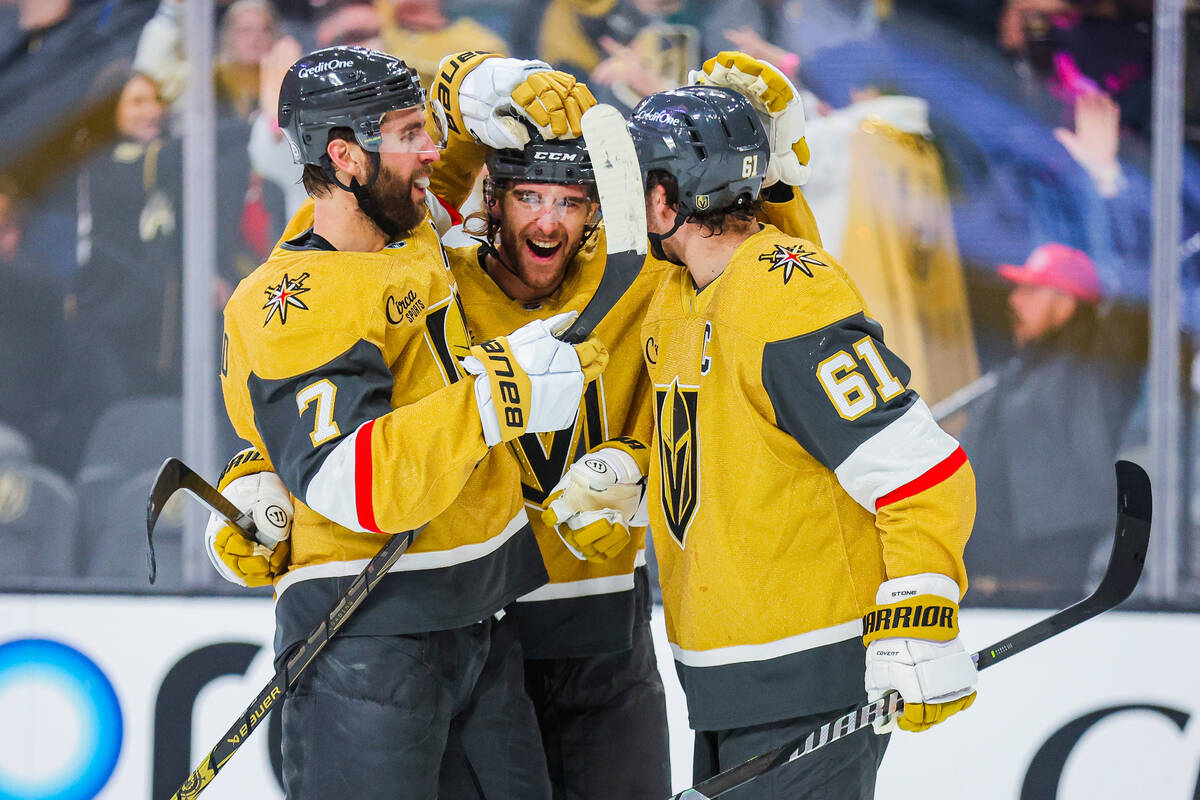 Golden Knights teammates celebrate a goal during an NHL hockey game between the Golden Knights ...