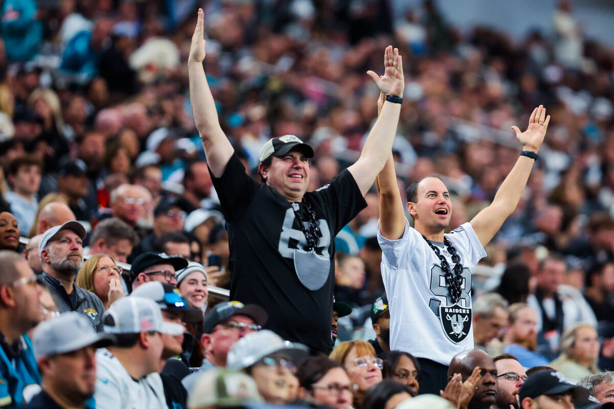 Raiders fans celebrate during an NFL football game between the Raiders and the Jacksonville Jag ...