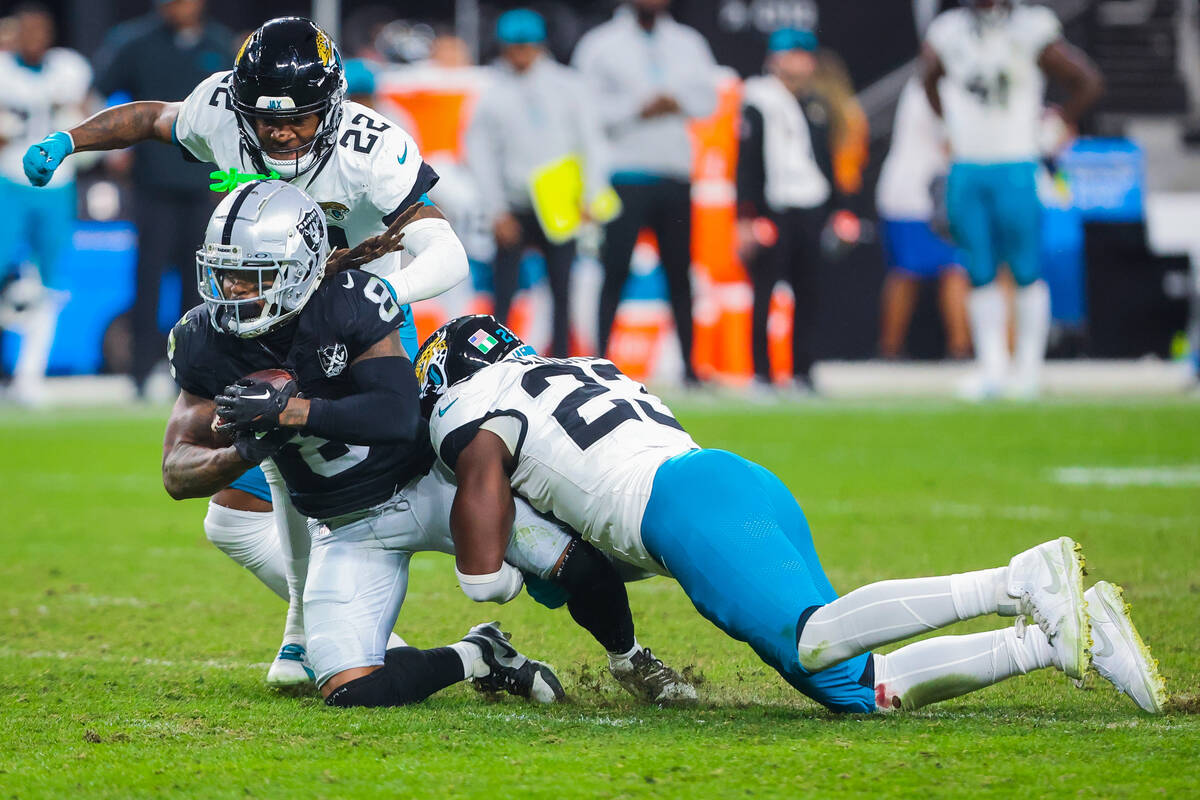 Raiders running back Ameer Abdullah (8) goes down with the ball as Jacksonville Jaguars cornerb ...