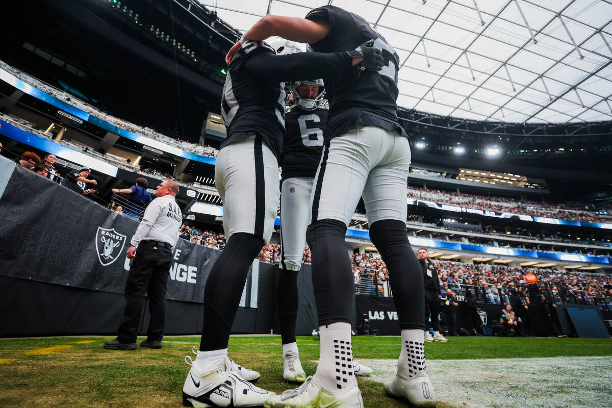 Raiders punter AJ Cole (6) prays with his teammates before an NFL football game between the Ra ...