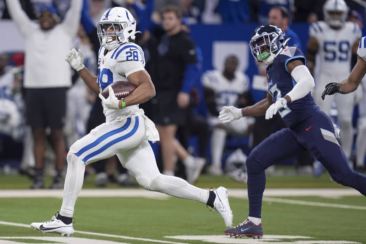 Indianapolis Colts running back Jonathan Taylor (28) runs for a touchdown during the first half ...