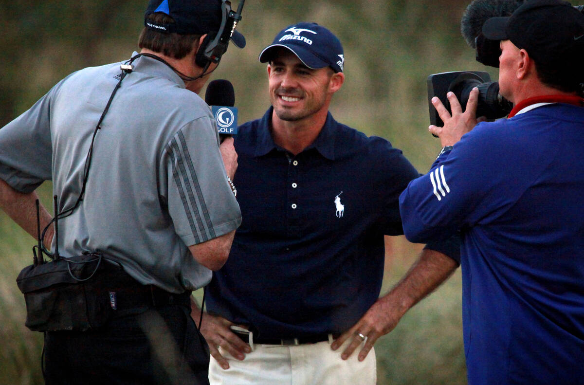 Jonathan Byrd is interviewed after sinking a hole in one on the fourth round of a playoff in th ...