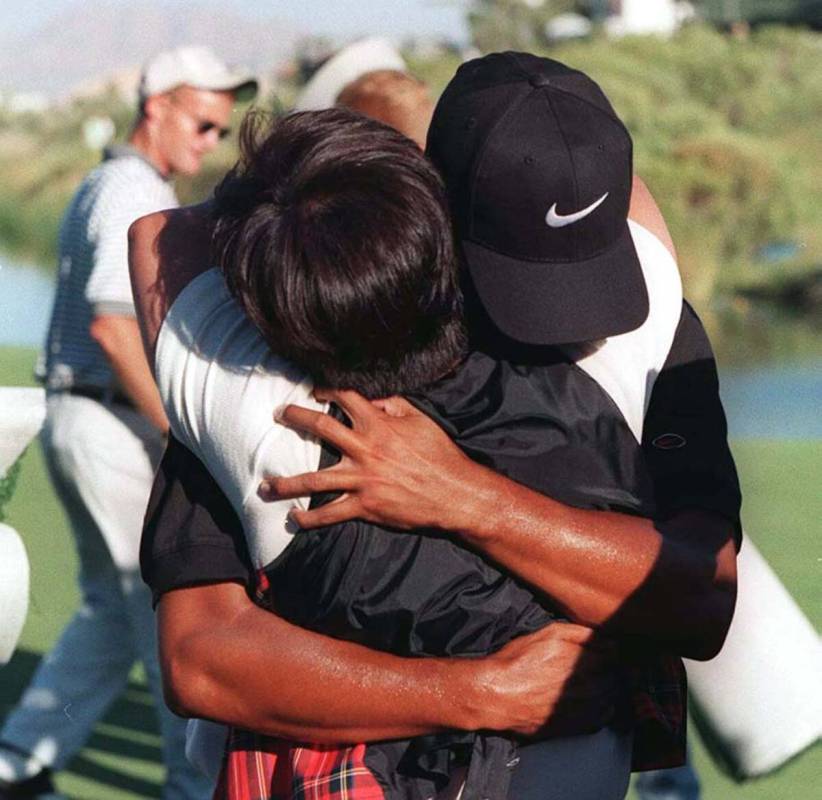 Tiger Woods hugs his mother after winning the Las Vegas Invitational on Oct. 6, 1996. Las Vegas ...