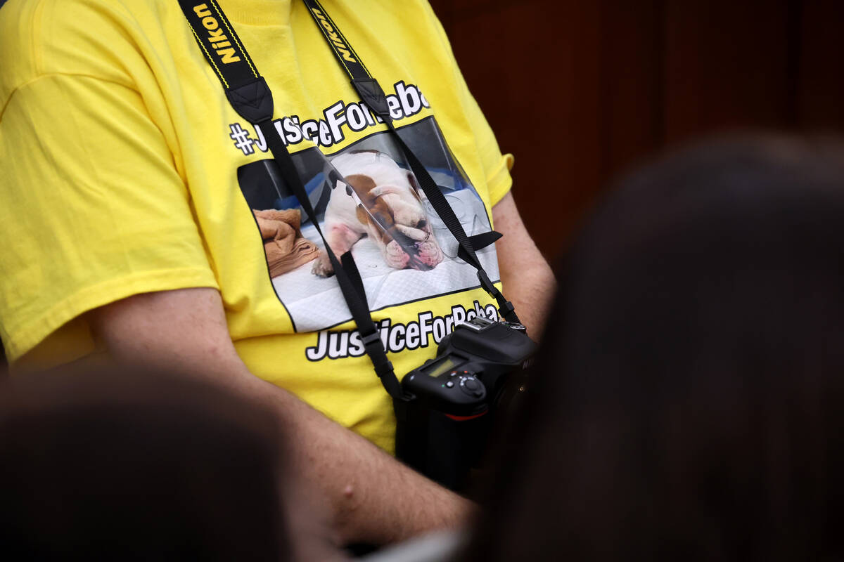 A supporter Reba the bulldog watches during a court hearing at the Regional Justice Center in L ...