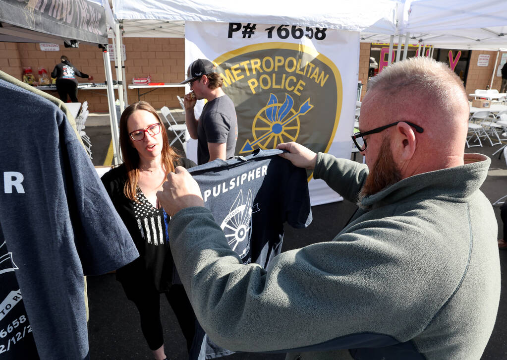 Retired Las Vegas police officer Brandon Eager buys a T-shirt honoring Metropolitan Police Depa ...