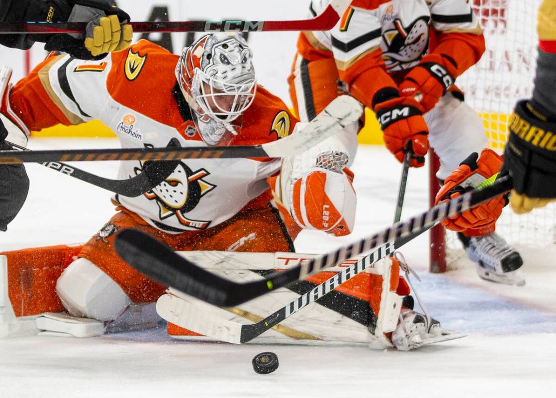 Anaheim Ducks goaltender Lukas Dostal (1) watches the puck through a sea of sticks during the t ...