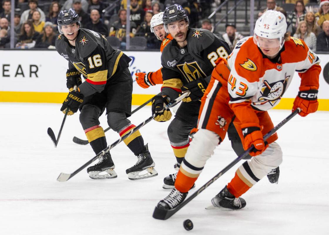 Golden Knights left wing Pavel Dorofeyev (16) watches Anaheim Ducks defenseman Drew Helleson (4 ...