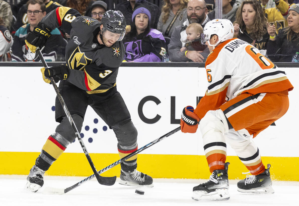 Golden Knights defenseman Brayden McNabb (3) and Anaheim Ducks defenseman Brian Dumoulin (6) co ...