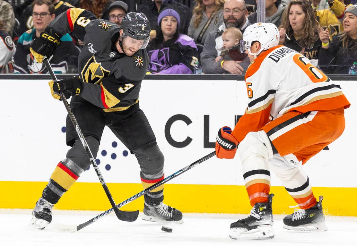 Golden Knights defenseman Brayden McNabb (3) and Anaheim Ducks defenseman Brian Dumoulin (6) co ...