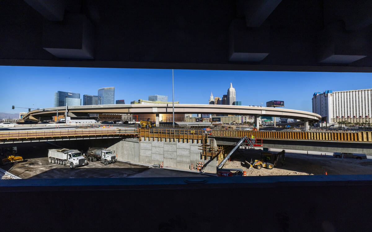 A crew continues to work on the bridge southbound from Tropicana Avenue onto the I-15 and other ...