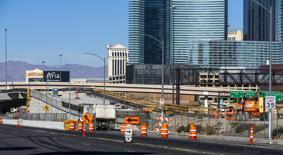 A crew continues to work on the bridge southbound from Tropicana Avenue onto the I-15 and other ...