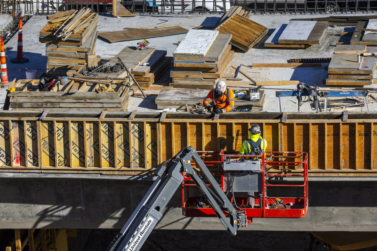 A crew continues to work on the bridge southbound from Tropicana Avenue onto the I-15 as the Tr ...