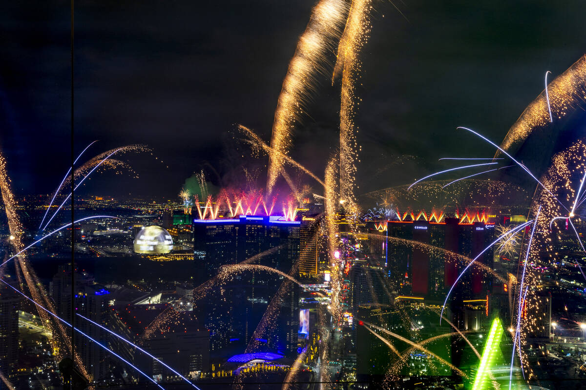 Fireworks erupt over the Las Vegas Strip as part of New Years Eve festivities across the city f ...