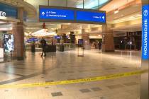 Police investigate a Christmas shooting at Sky Harbor Airport in Phoenix late Wednesday, Dec. 2 ...