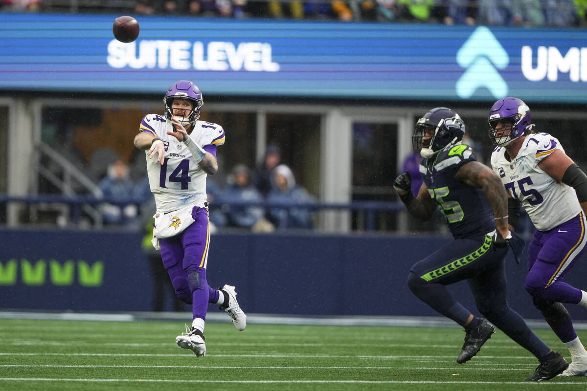 Minnesota Vikings quarterback Sam Darnold throws against the Seattle Seahawks during an NFL foo ...