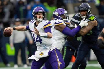 Minnesota Vikings quarterback Sam Darnold passes the ball during an NFL football game against t ...