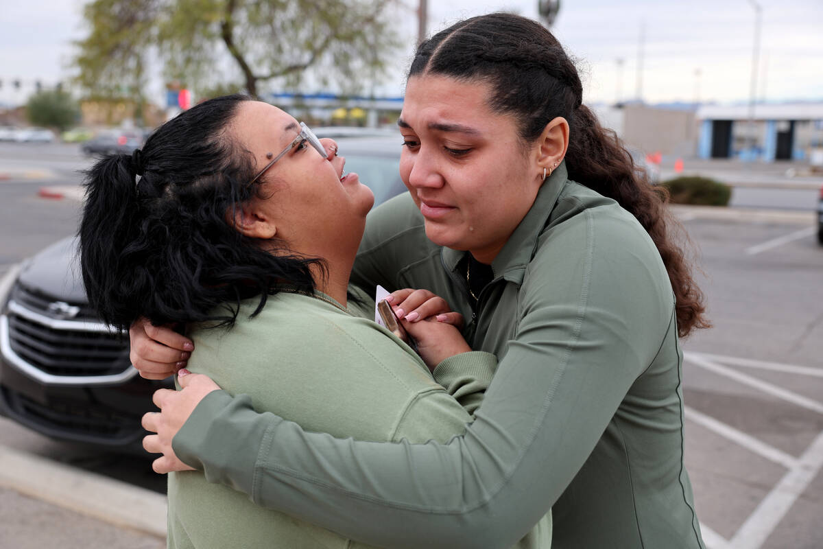 Raygan Wolfe, sister of shooting victim Renise “NeNe” Wolfe, 33, left, and cousin Karli Wol ...