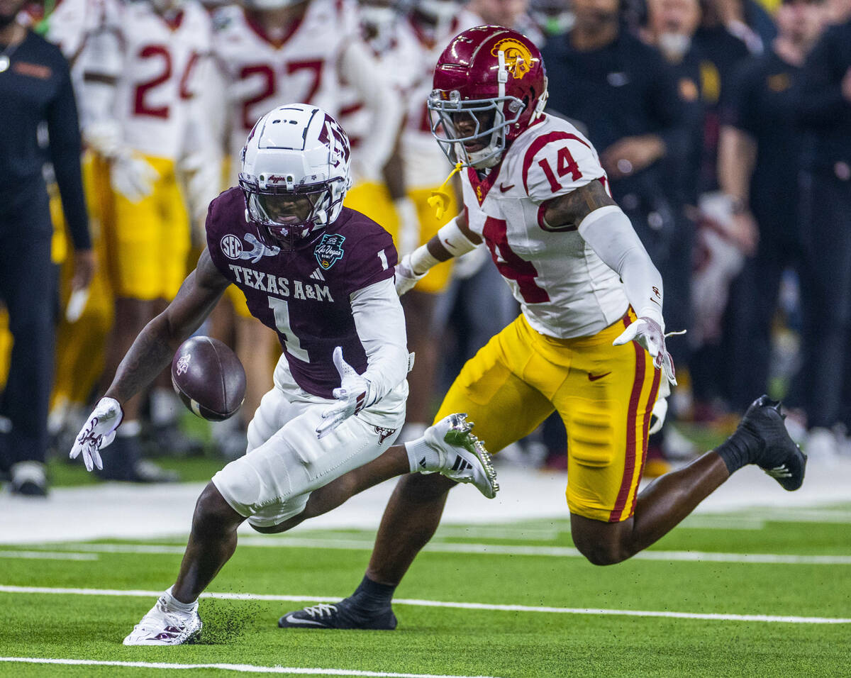 Texas A&M Aggies wide receiver Jabre Barber (1) eyes a pass with USC Trojans cornerback Jac ...