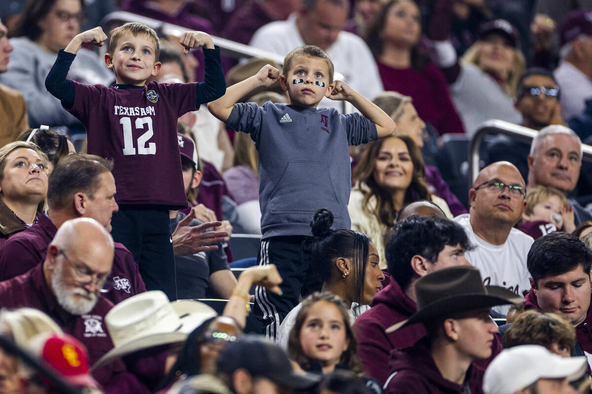 Texas A&M Aggies fans flex in the stands against the USC Trojans during the first half of t ...