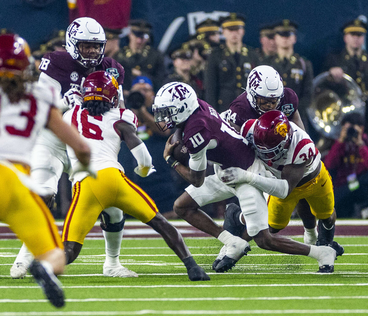 Texas A&M Aggies quarterback Marcel Reed (10) is sacked by USC Trojans defensive end Brayla ...