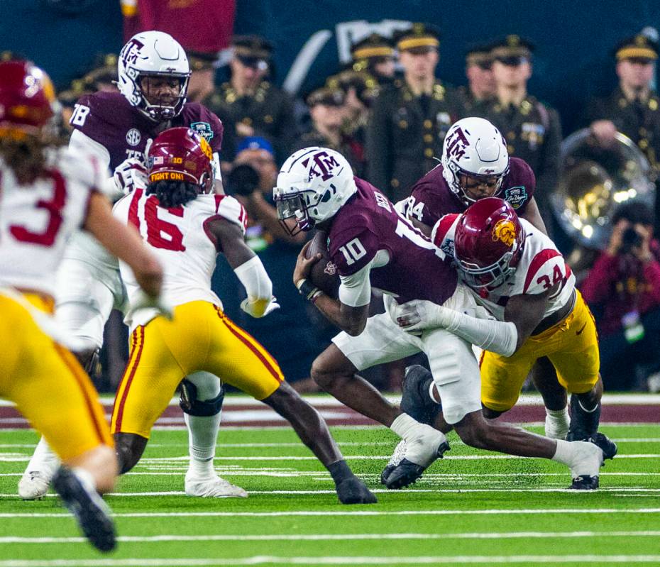 Texas A&M Aggies quarterback Marcel Reed (10) is sacked by USC Trojans defensive end Brayla ...