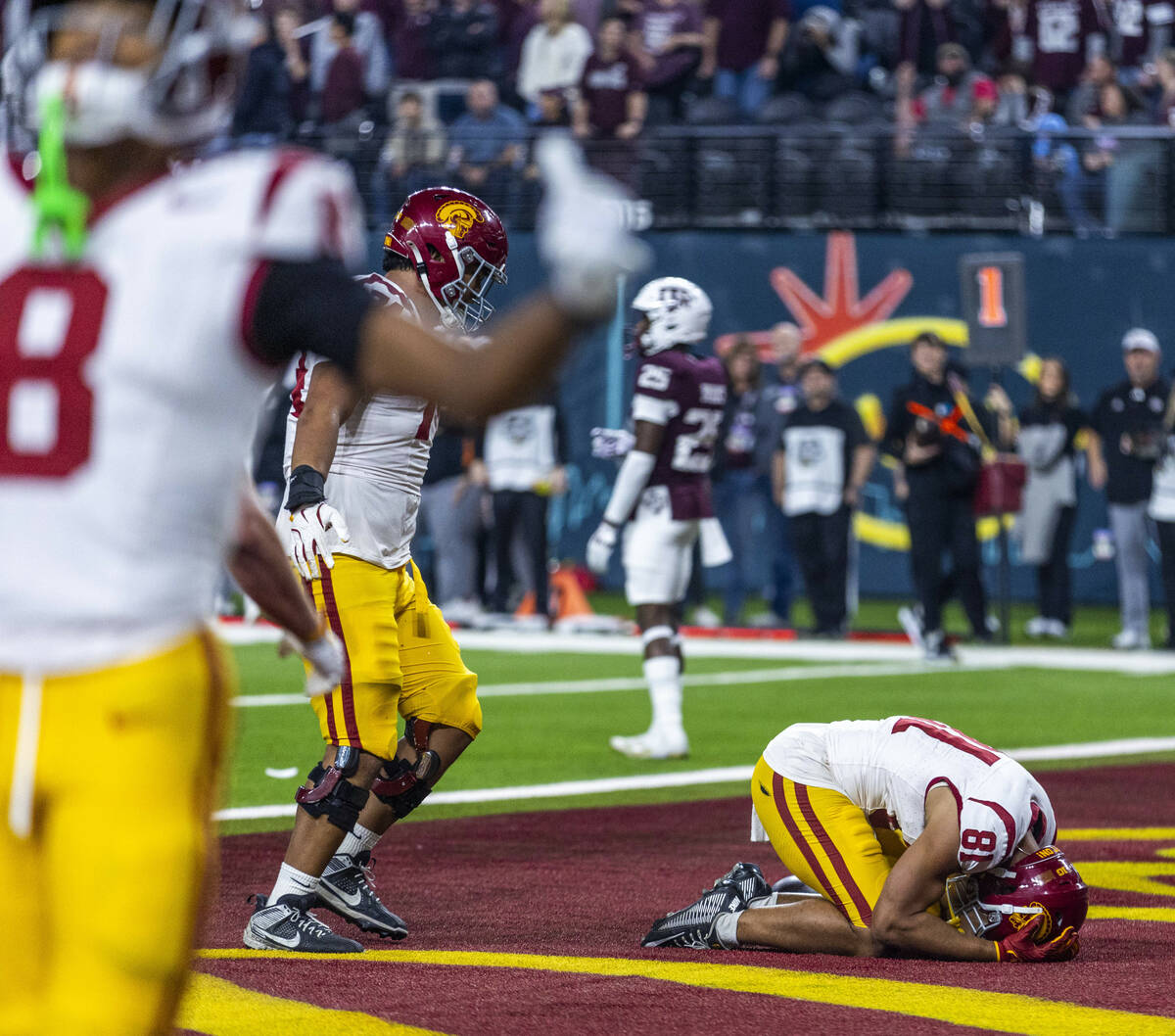 USC Trojans wide receiver Kyle Ford (81) is overwhelmed in the end zone making the winning scor ...