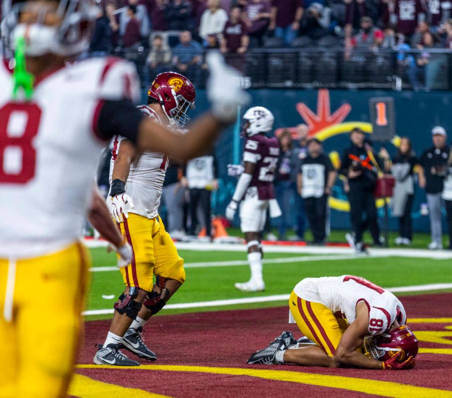 USC Trojans wide receiver Kyle Ford (81) is overwhelmed in the end zone making the winning scor ...