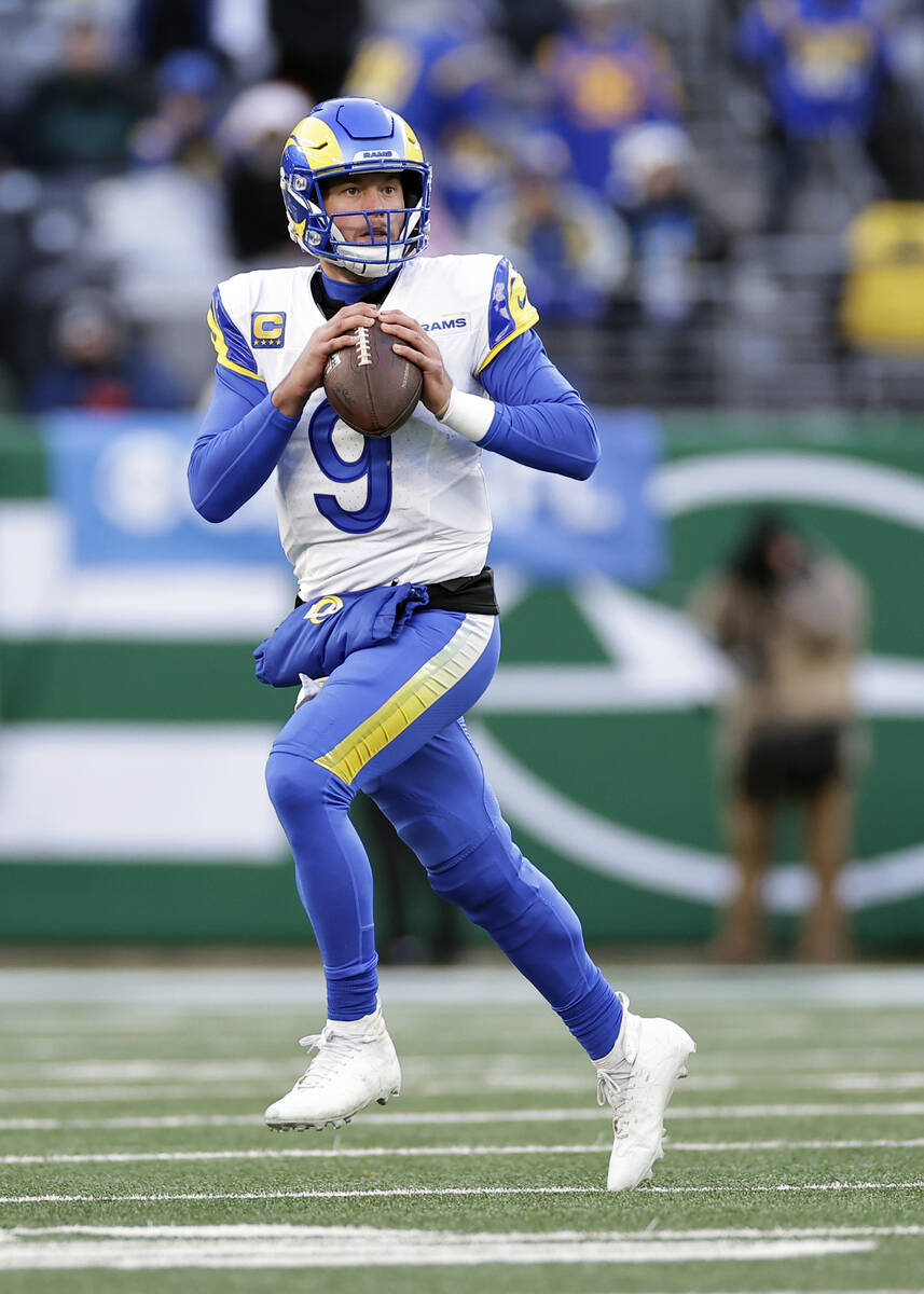 Los Angeles Rams quarterback Matthew Stafford (9) looks to pass the ball during an NFL football ...