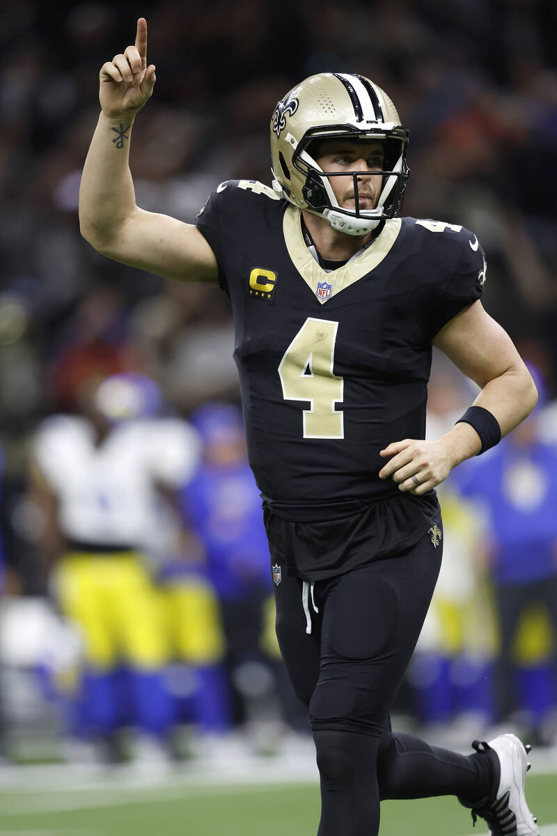 New Orleans Saints quarterback Derek Carr (4) celebrates after a touchdown during an NFL footba ...