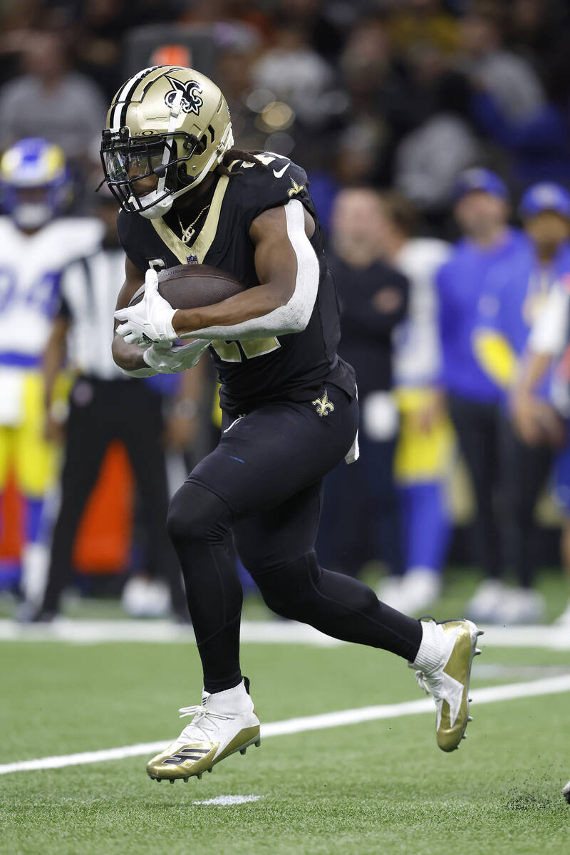 New Orleans Saints running back Alvin Kamara (41) runs the ball during an NFL football game aga ...