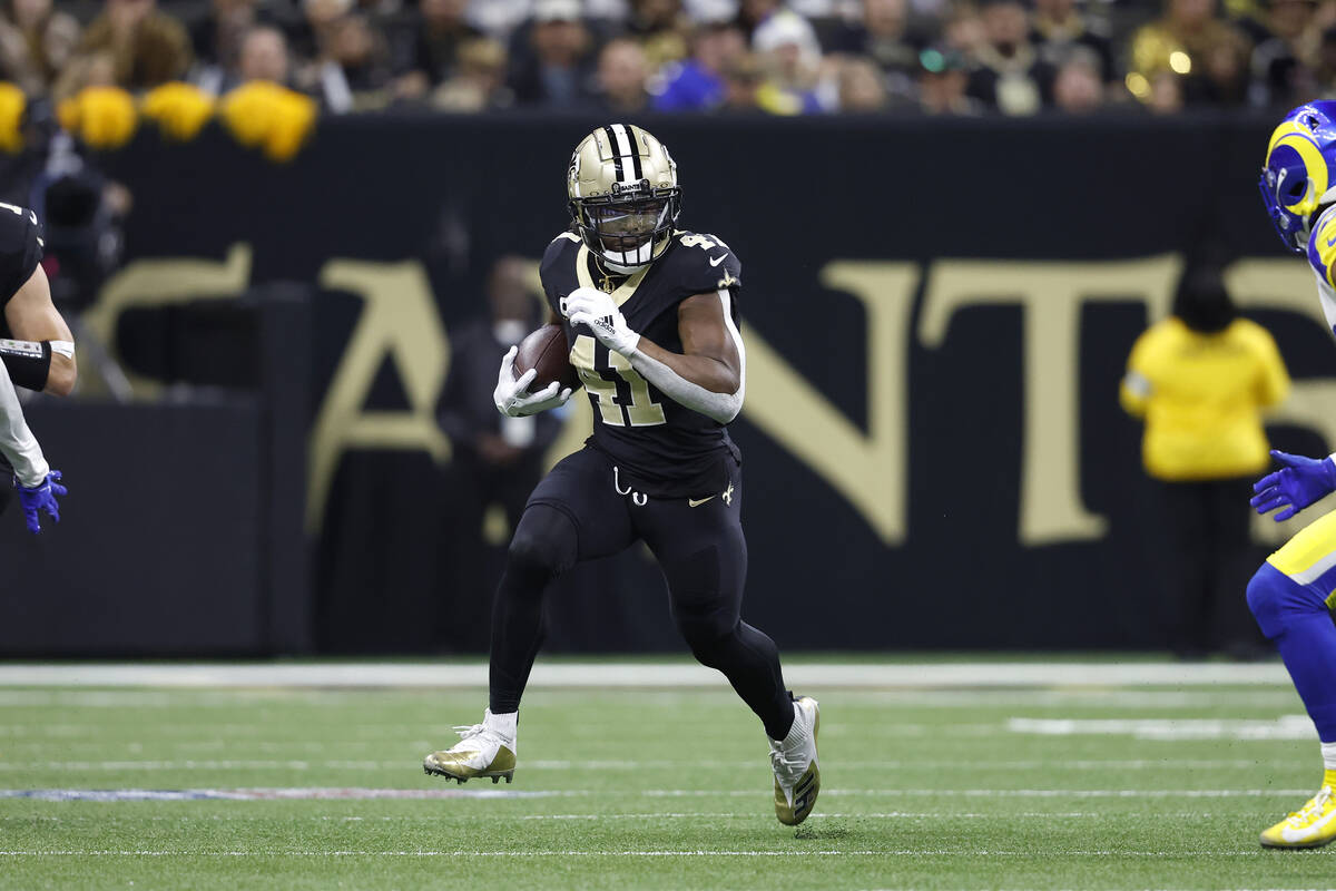 New Orleans Saints running back Alvin Kamara (41) runs the ball during an NFL football game aga ...