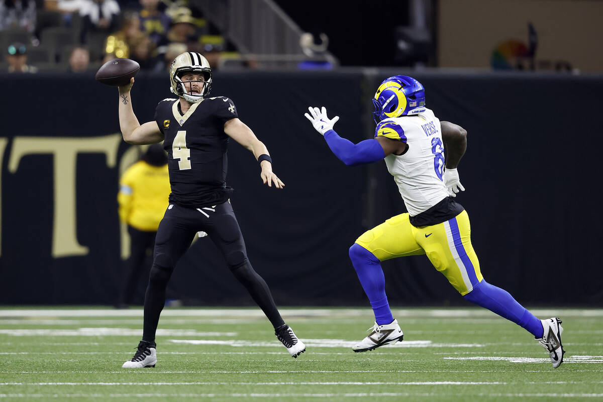 New Orleans Saints quarterback Derek Carr (4) looks to pass during an NFL football game against ...