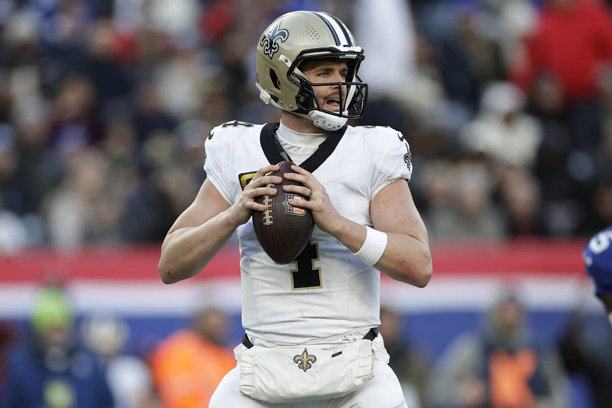 New Orleans Saints quarterback Derek Carr (4) looks to pass the ball during an NFL football gam ...