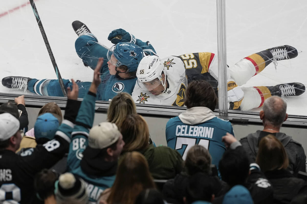 San Jose Sharks center Will Smith, top left, and Vegas Golden Knights right wing Keegan Kolesar ...